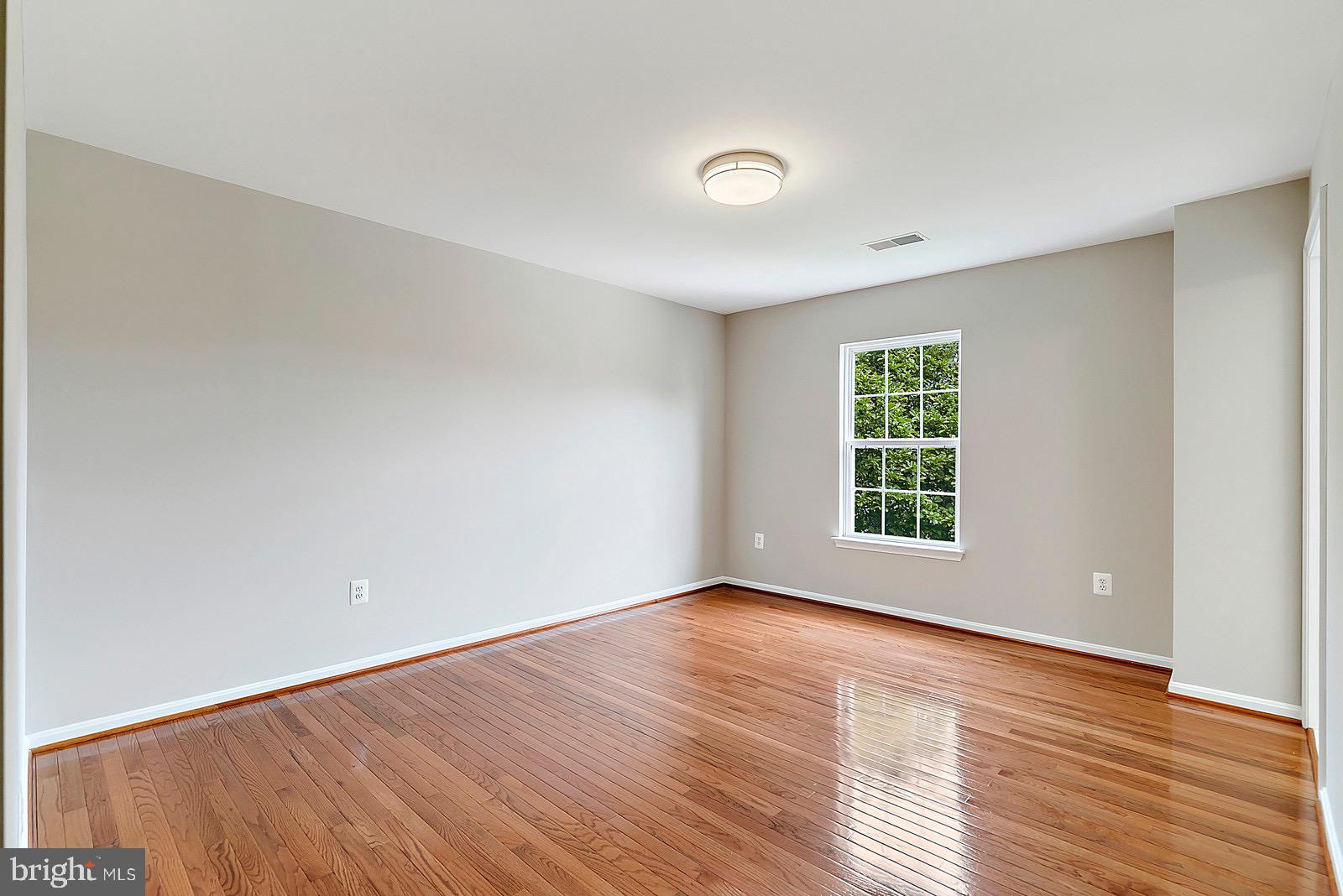 4175 Bell Ridge Court Chantilly, VA 20151 - Photo 32 of 48 an empty room with wooden floor and windows