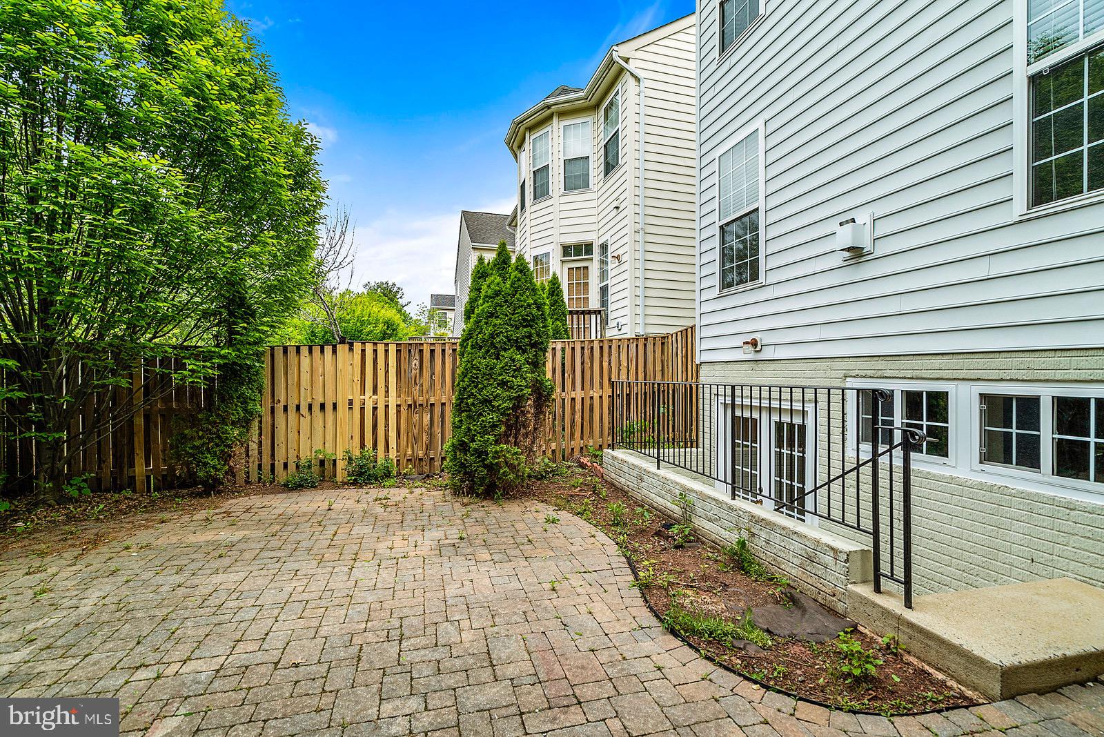 4175 Bell Ridge Court Chantilly, VA 20151 - Photo 47 of 48 a view of a house with a small yard and wooden fence