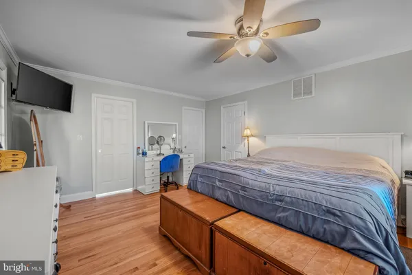 a bedroom with bed and window
