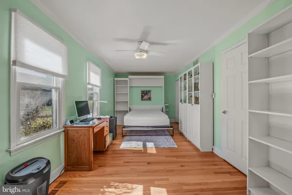 a living room with furniture rug and window
