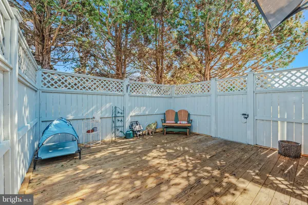 a view of backyard with swimming pool and sitting area