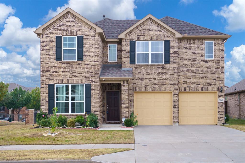 6049 Iron Creek Road Fort Worth, TX 76137 - Photo 2 of 30 a front view of a house with a yard and garage