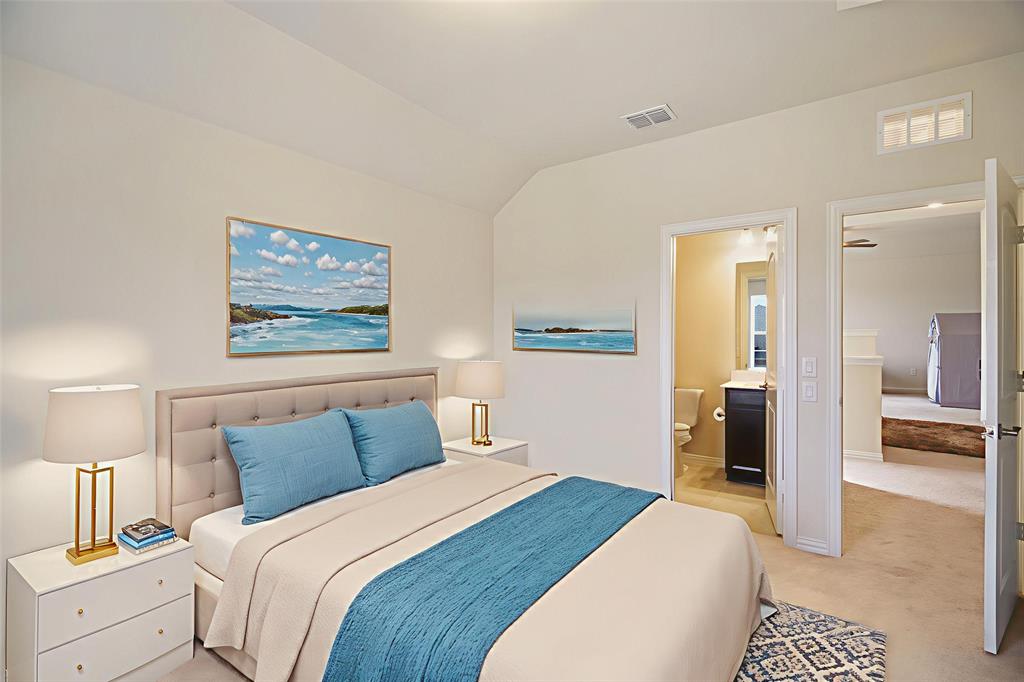 6049 Iron Creek Road Fort Worth, TX 76137 - Photo 22 of 30 a bedroom with bed and painting on the wall