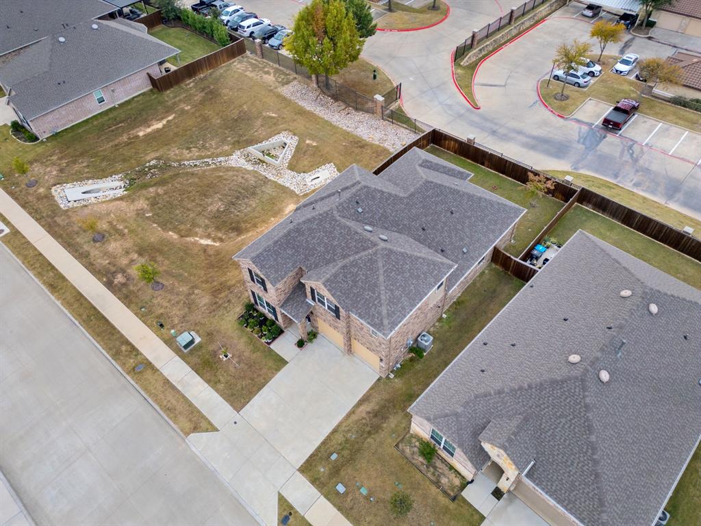 6049 Iron Creek Road Fort Worth, TX 76137 - Photo 29 of 30 an aerial view of residential houses with outdoor space