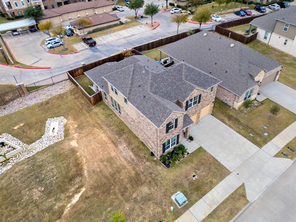 6049 Iron Creek Road Fort Worth, TX 76137 - Photo 5 of 30 an aerial view of residential houses with outdoor space
