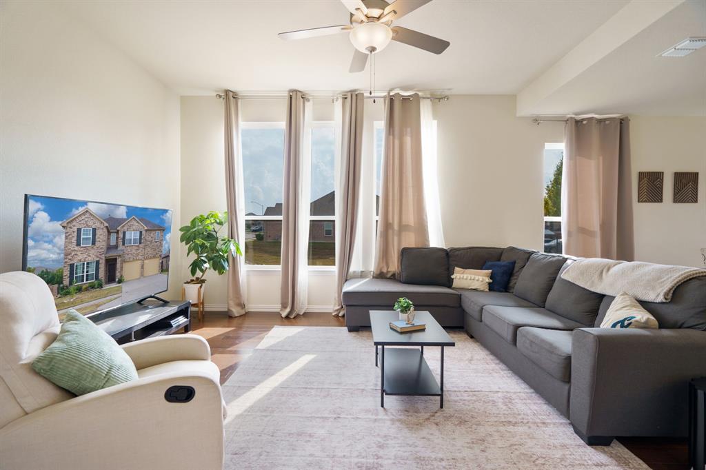 6049 Iron Creek Road Fort Worth, TX 76137 - Photo 7 of 30 a living room with furniture and a large window