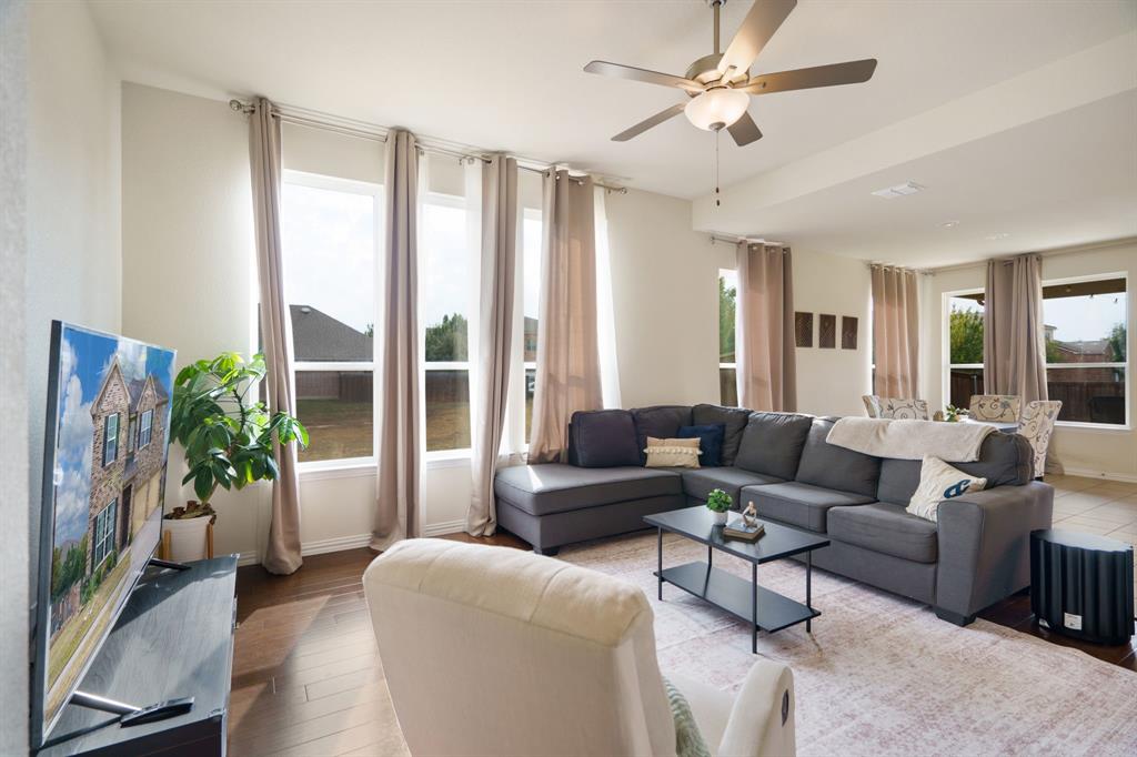 6049 Iron Creek Road Fort Worth, TX 76137 - Photo 8 of 30 a living room with furniture and a large window