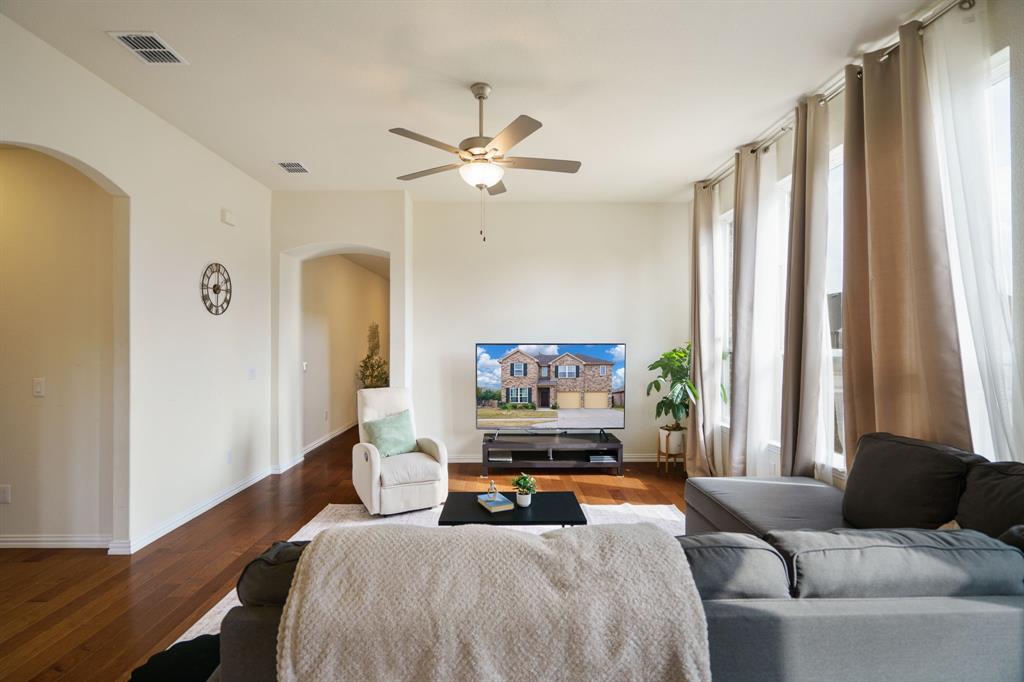 6049 Iron Creek Road Fort Worth, TX 76137 - Photo 9 of 30 a bedroom with a bed furniture and a large window