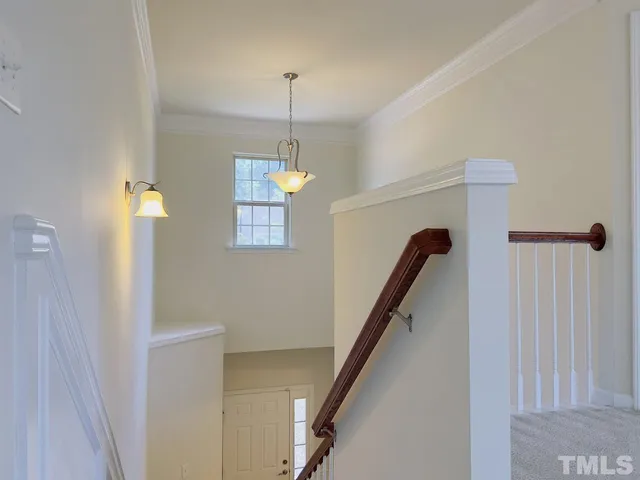 a view of a hallway with front door