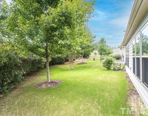 a view of a wrought iron fences in front of the house