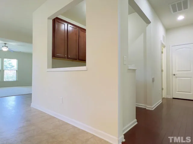 an entryway with wooden floor