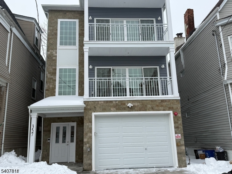 a front view of a house with a balcony