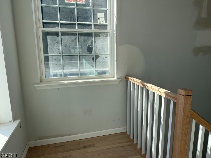 357 South 11th Street, Unit 3 Newark, NJ 07103 - Photo 11 of 13 a view of wooden floor and a window