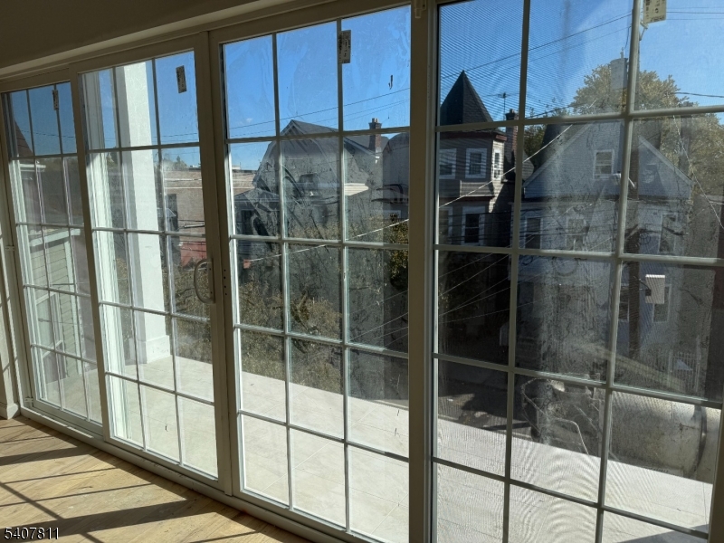 357 South 11th Street, Unit 3 Newark, NJ 07103 - Photo 12 of 13 a bathroom with a glass shower door