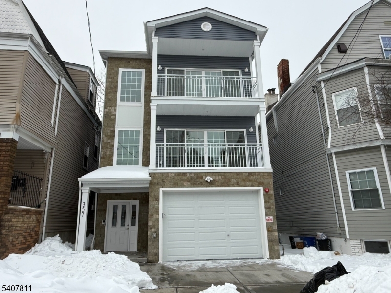 357 South 11th Street, Unit 3 Newark, NJ 07103 - Photo 2 of 13 a front view of a house with a door