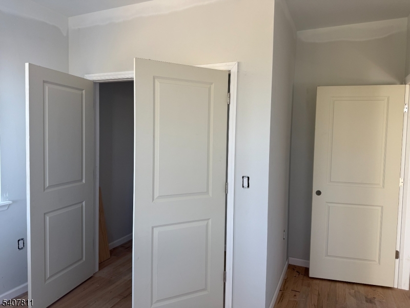 357 South 11th Street, Unit 3 Newark, NJ 07103 - Photo 3 of 13 a view of a hallway with wooden floor