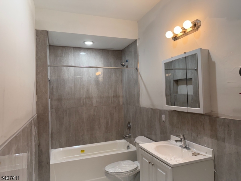 357 South 11th Street, Unit 3 Newark, NJ 07103 - Photo 5 of 13 a bathroom with a sink toilet and shower
