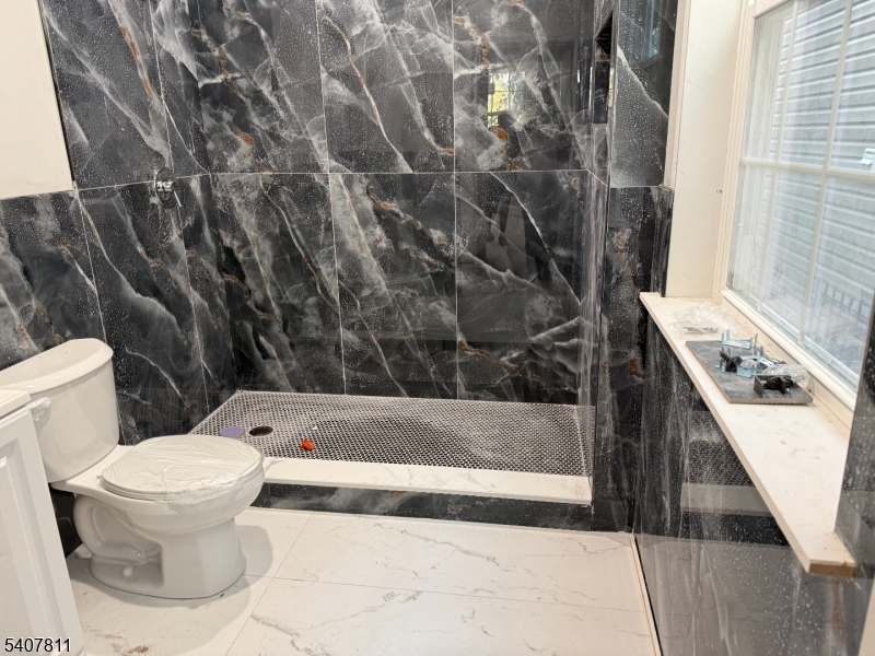 357 South 11th Street, Unit 3 Newark, NJ 07103 - Photo 10 of 13 a bathroom with a toilet and a shower