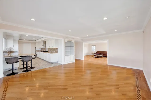 a view of kitchen and dining room with wooden floor