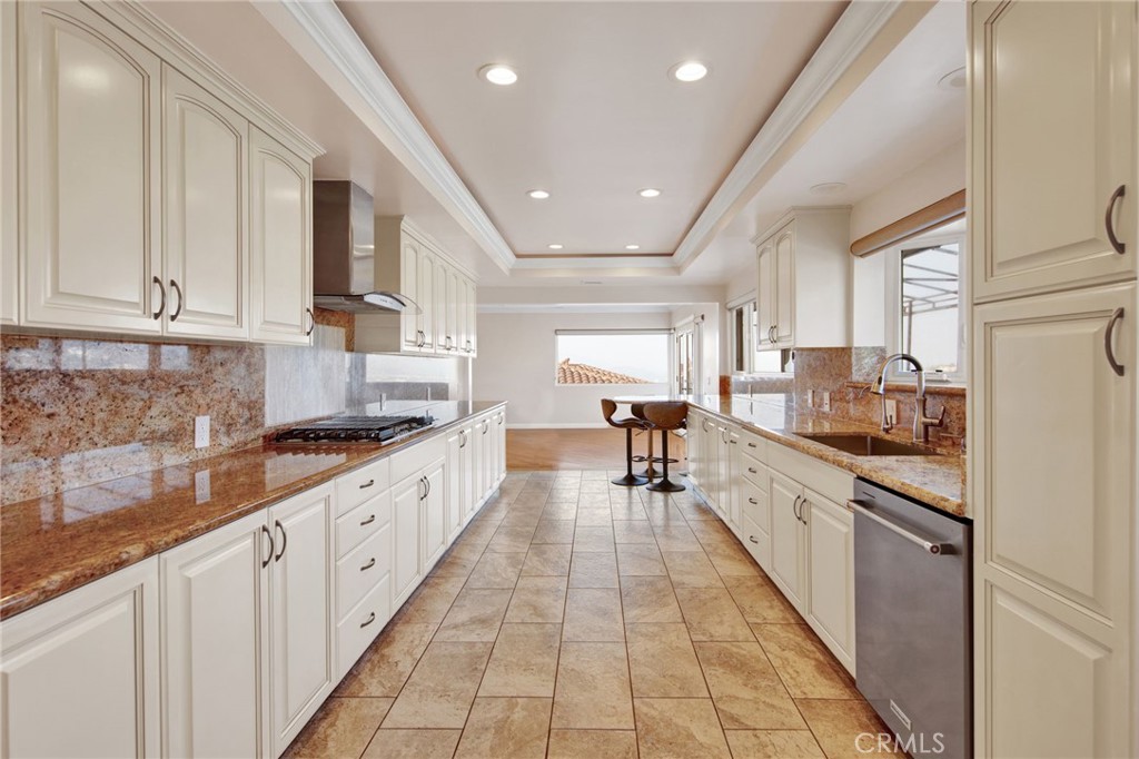 1259 Swarthmore Drive Glendale, CA 91206 - Photo 12 of 33 a large kitchen with stainless steel appliances granite countertop a lot of counter space and wooden floors