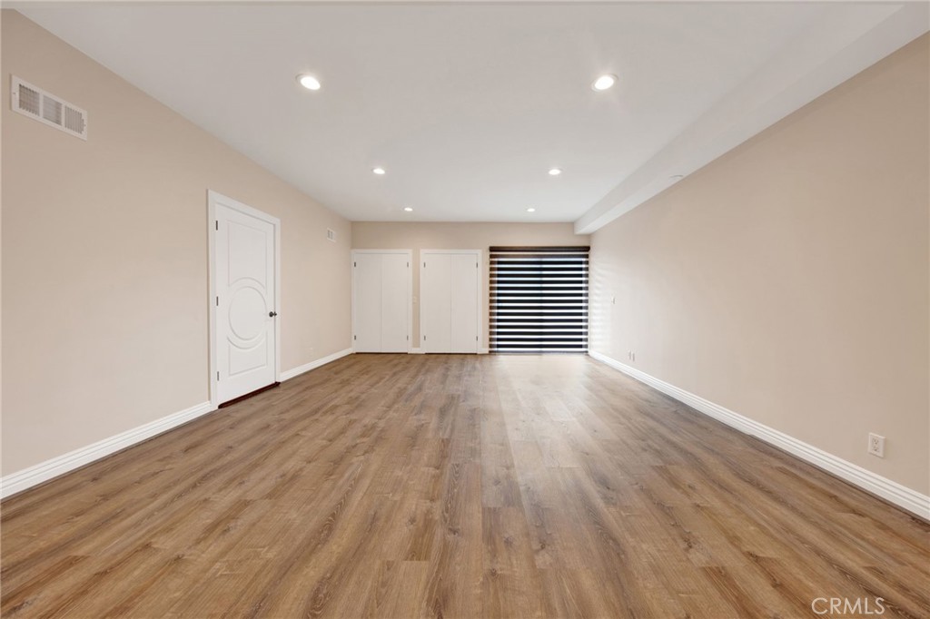 1259 Swarthmore Drive Glendale, CA 91206 - Photo 23 of 33 a view of a room with wooden floor and window