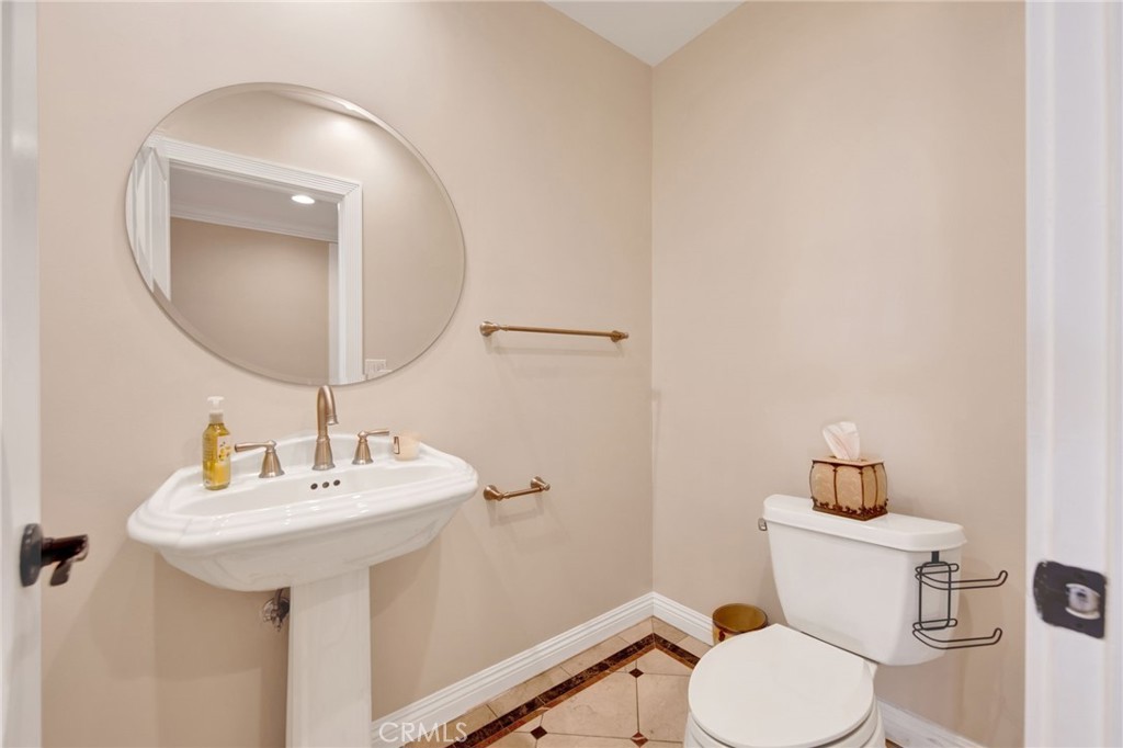 1259 Swarthmore Drive Glendale, CA 91206 - Photo 28 of 33 a bathroom with a sink mirror and toilet