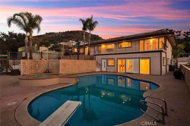 a view of building with a swimming pool