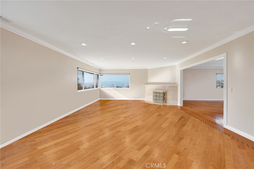 1259 Swarthmore Drive Glendale, CA 91206 - Photo 8 of 33 a view of empty room with wooden floor