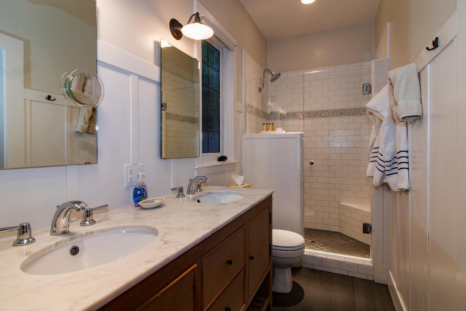 Undisclosed Address Santa Barbara, CA 93101 - Photo 12 of 24 a bathroom with a granite countertop sink toilet and shower