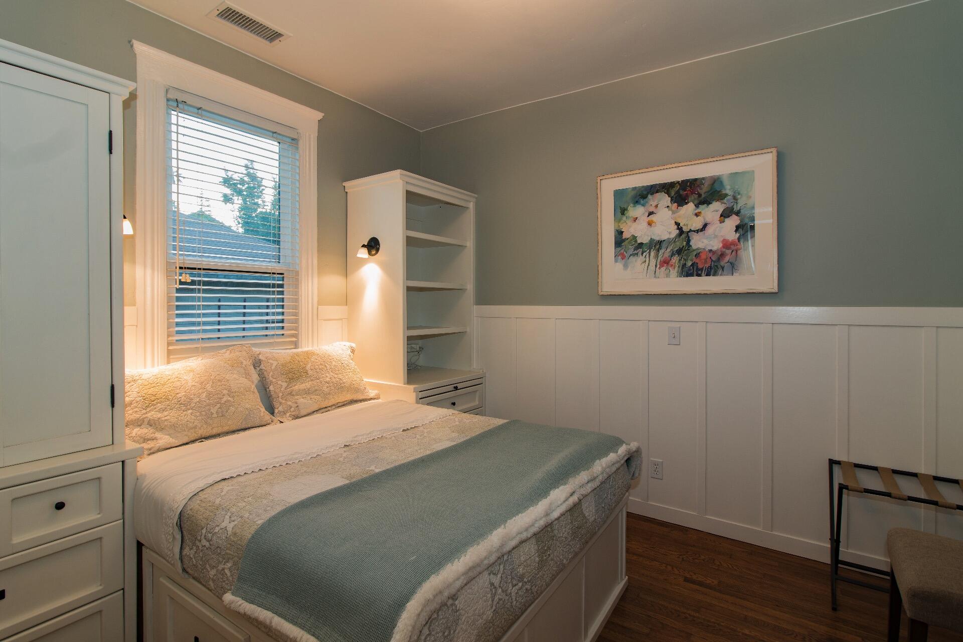 Undisclosed Address Santa Barbara, CA 93101 - Photo 13 of 24 a bedroom with a bed and a painting on the wall