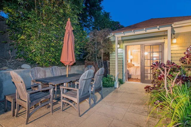 a view of a chairs and table in patio