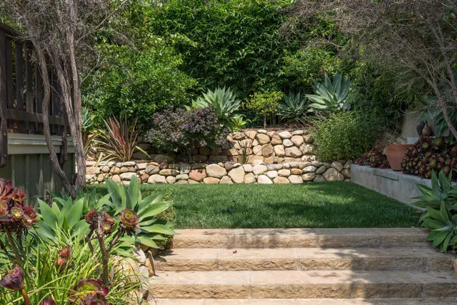 a backyard of a house with lots of green space
