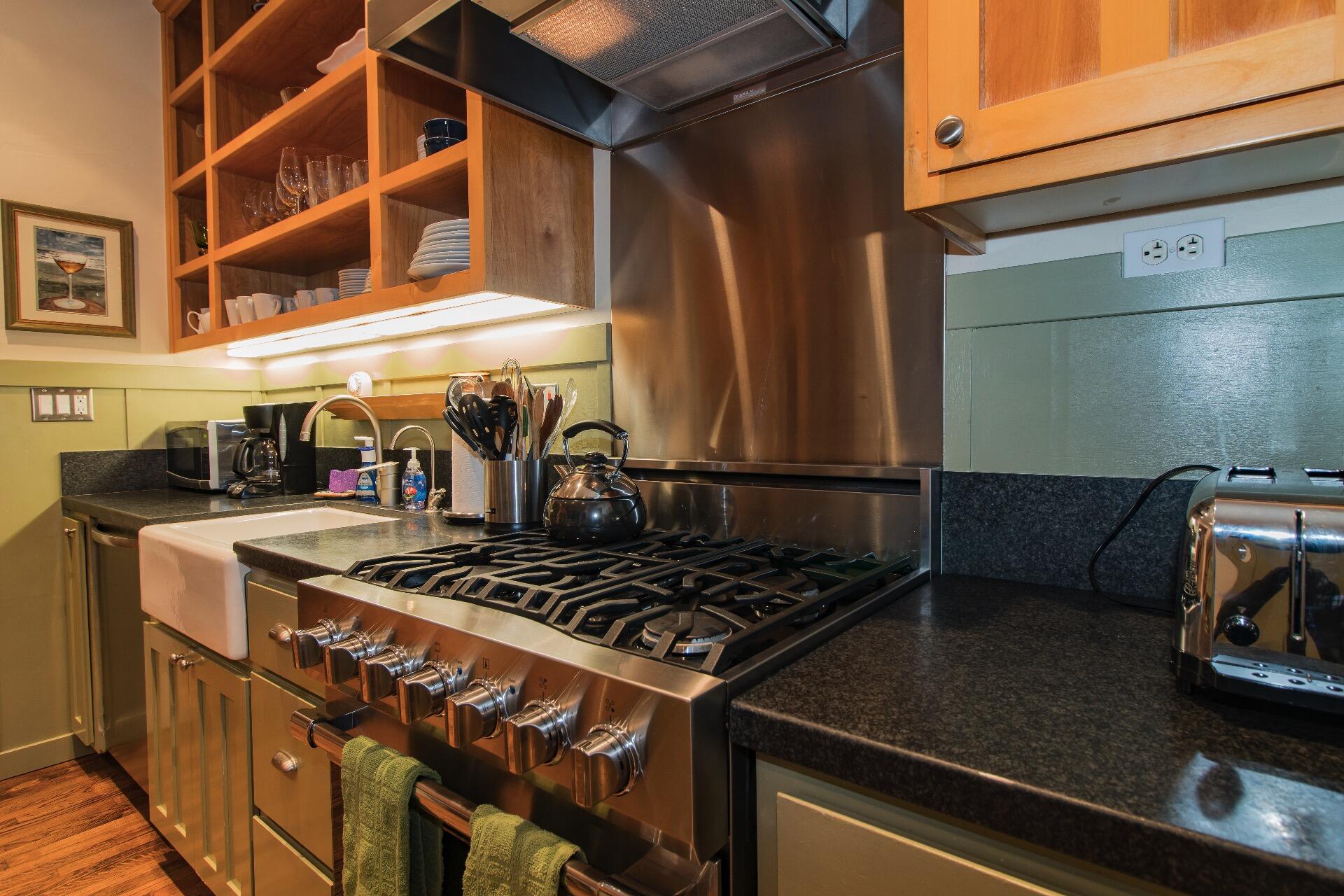 Undisclosed Address Santa Barbara, CA 93101 - Photo 4 of 24 a stove top oven sitting inside of a kitchen