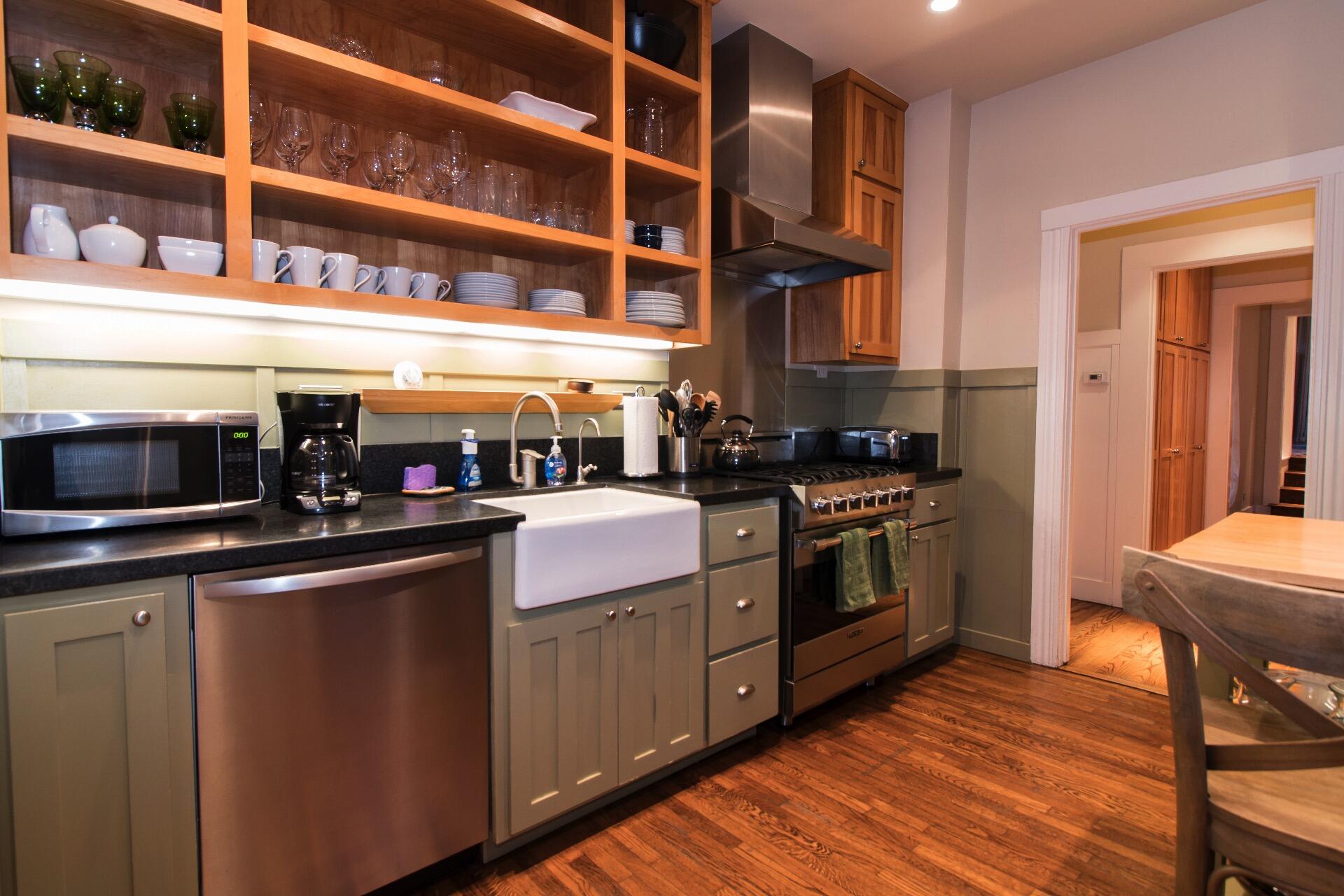 Undisclosed Address Santa Barbara, CA 93101 - Photo 5 of 24 a kitchen with a stove top oven and cabinets