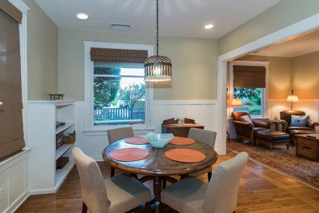 a living room with furniture a window and a table