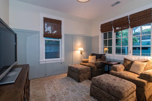 a bedroom with furniture and a window