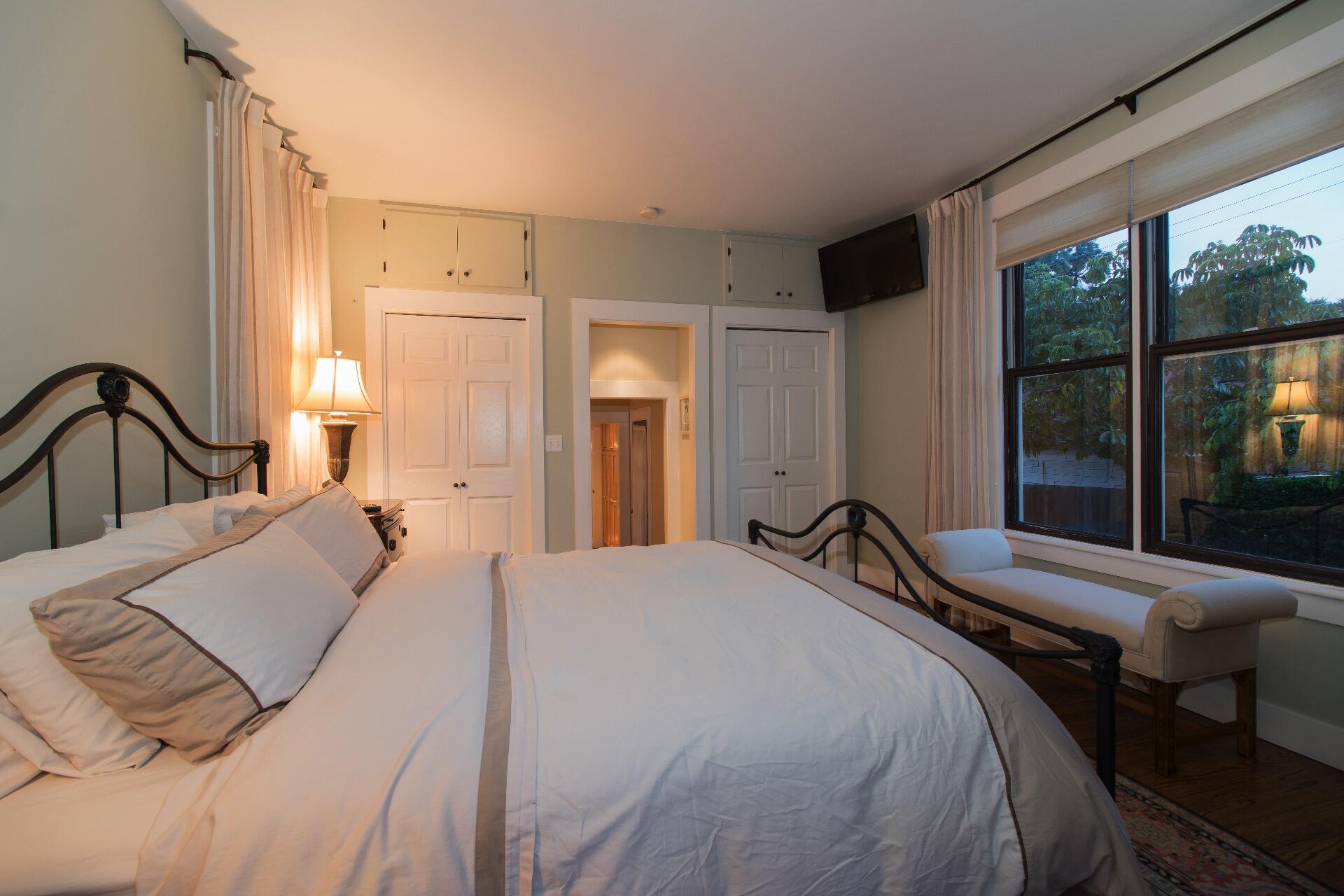 Undisclosed Address Santa Barbara, CA 93101 - Photo 10 of 24 a bedroom with a bed and a large window