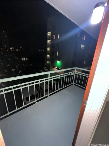 a view of balcony with furniture