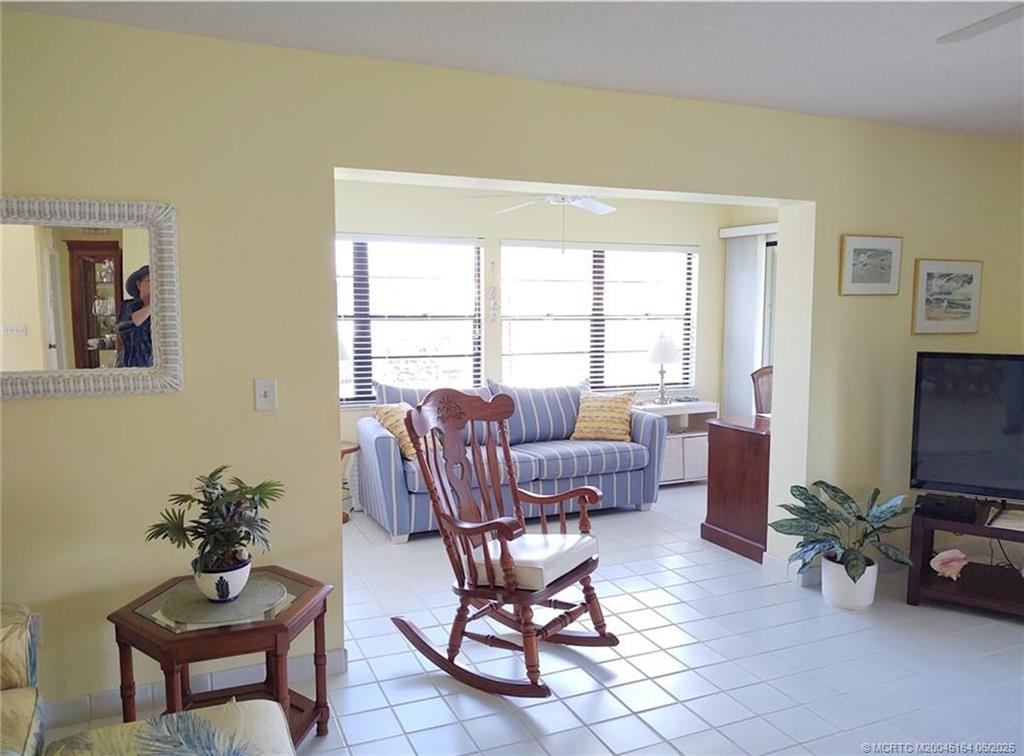 Undisclosed Address Stuart, FL 34997 - Photo 20 of 81 a living room with furniture a table and a potted plant