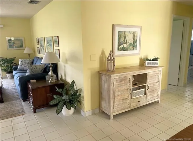 a kitchen with granite countertop a sink cabinets and stove top oven