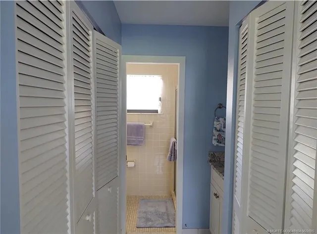 a view of storage and utility room with washer and dryer