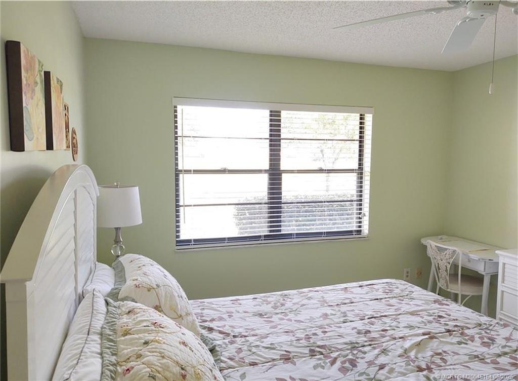 Undisclosed Address Stuart, FL 34997 - Photo 43 of 81 a bedroom with a bed and a window