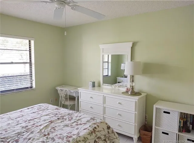 a view of a house with pool and a yard