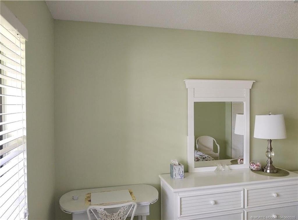 Undisclosed Address Stuart, FL 34997 - Photo 45 of 81 a bathroom with a toilet a sink and mirror