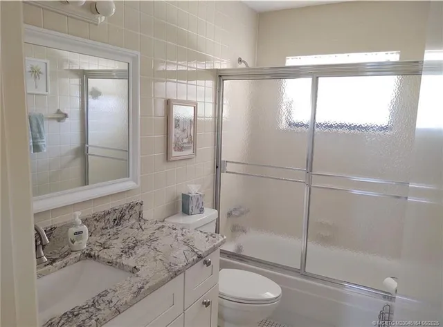 a view of a swimming pool with a lounge chairs