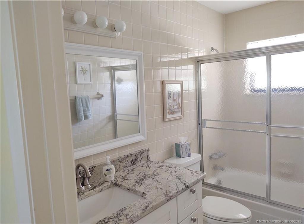 Undisclosed Address Stuart, FL 34997 - Photo 50 of 81 a bathroom with a sink toilet and shower