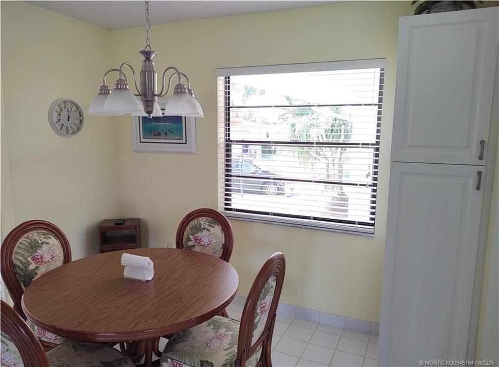 Undisclosed Address Stuart, FL 34997 - Photo 5 of 81 a view of a dining room with furniture and a window