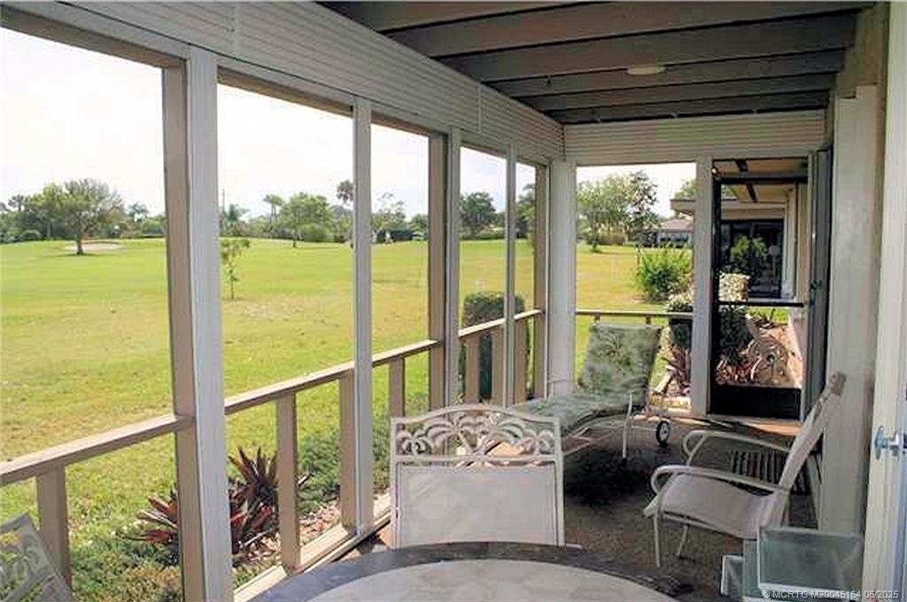 Undisclosed Address Stuart, FL 34997 - Photo 56 of 81 a living room with furniture and a floor to ceiling window