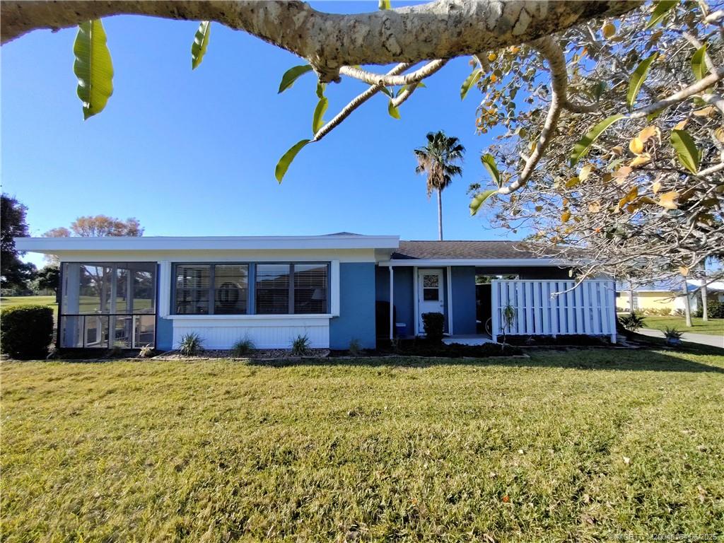 Undisclosed Address Stuart, FL 34997 - Photo 72 of 81 a view of a house with a yard and sitting area