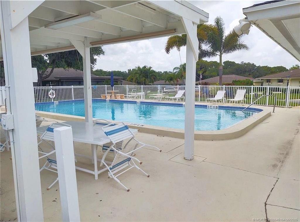 Undisclosed Address Stuart, FL 34997 - Photo 78 of 81 a view of a swimming pool with a lounge chairs